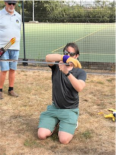 Glove ceremonially fitted and pair of arrows held